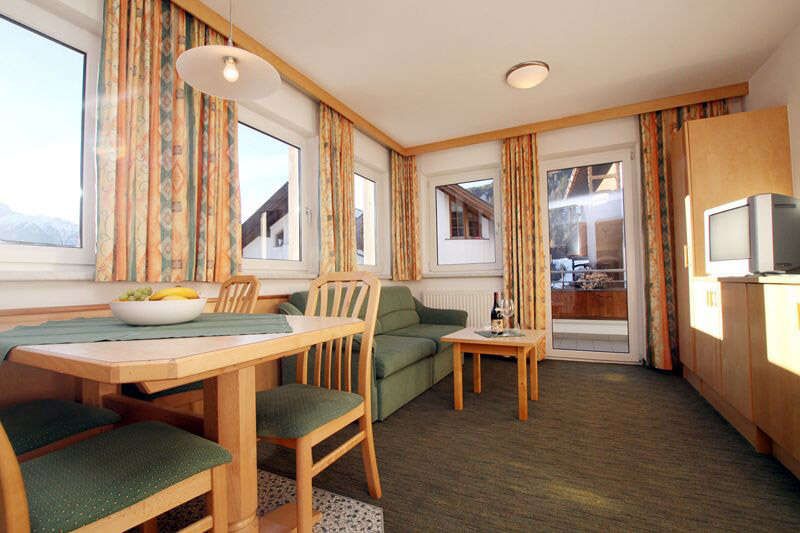  Living room with balcony in apartment 3 in the Landhaus Schwarz in Tirol