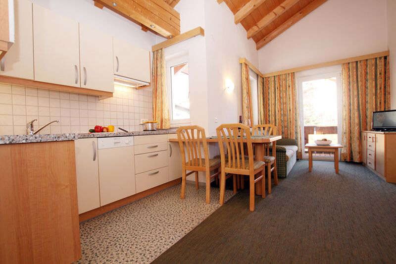 Living room with kitchen in apartment 2 in the Landhaus Schwarz 